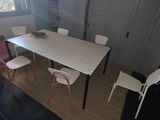 overhead view of a dining room with a table and chairs