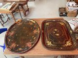 two trays that are sitting on a table