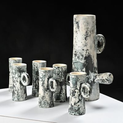 a group of cups that are sitting on a table