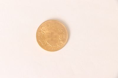 an image of a gold coin on a white surface