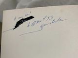 a handwritten note with a pen on top of a piece of paper