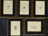 four framed drawings of a man and a woman on a wall