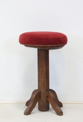 an image of a stool with a red cushion on it