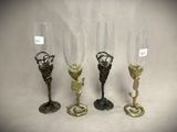 three wine glasses sitting next to each other on a table