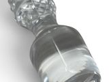 a glass bottle with a glass stopper on a white surface