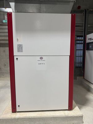 two refrigerators that are sitting in a garage