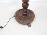 a wooden table with a lamp on top of it