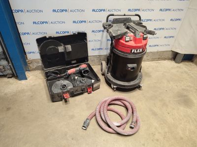 l'aspirateur se trouve à côté d'une boîte à outils et d'un tuyau