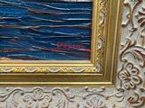 an oil painting of a sailboat on the ocean in a gold frame