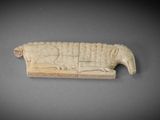an image of a carved piece of a couch with a cat on it