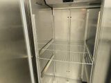 a stainless steel refrigerator that is open to show the inside