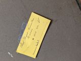 a yellow piece of paper sitting on the floor
