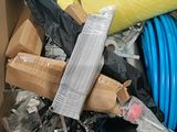 a cardboard box full of different types of hoses and hoses