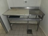 an image of a kitchen area with a sink and a counter