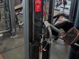 a gym room with a row of machines in it