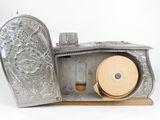 an old silver case with a tape in it on a white background