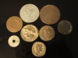 a lot of coins that are on the table