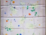 an image of a square scarf with flowers and leaves on it