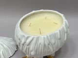 a candle that is sitting next to a candle holder
