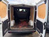 a van that has been vandalized and is parked in a parking lot