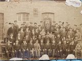 an old photo of a group of men in suits and ties