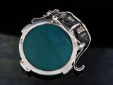 sterling silver ring with a turquoise stone and a diamond accent