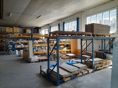 a large warehouse filled with lots of boxes and pallets