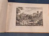 an open book with a drawing of a landscape on it