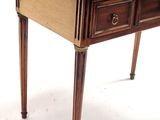a small wooden table with two drawers on top of it