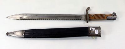 two knives that are laying side by side on a table