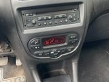the dashboard of a car with a digital clock on the dash