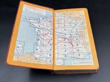 an open book with a map on it on a table