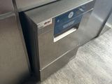 a silver dishwasher and a silver refrigerator in a kitchen