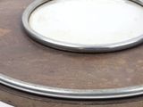 a close up of a metal plate on a table