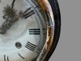 a close up of a clock with roman numerals on it