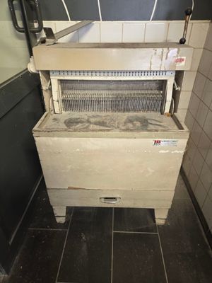a machine that is sitting in the corner of a room
