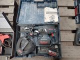 many tools in a tool box on a wooden table