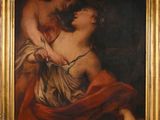 une peinture ancienne représentant une femme tenant un enfant sur ses genoux