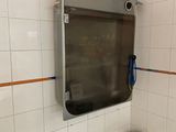 a sink in a bathroom with a mirror above it