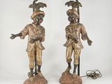 pair of antique bronze figurines of a man and a woman