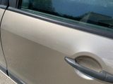 a car door handle on the side of the car