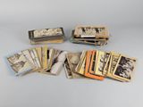 an assortment of old and new photographs are displayed on a table