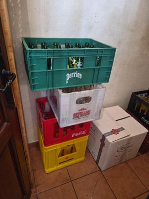 boxes of beer are stacked on top of each other in a room