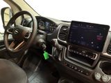 the interior of a vehicle with a steering wheel, dashboard, and dashboard controls