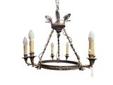 an image of a chandelier with three candles and a bird on it
