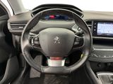 the interior of a car with a steering wheel and dashboard controls