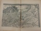 an old map of a city in a book on a table
