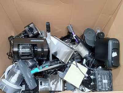 a cardboard box full of electronic devices and electronics