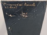 a black piece of wood with writing on it