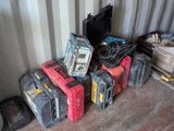 a pile of tools sitting on the floor in a room